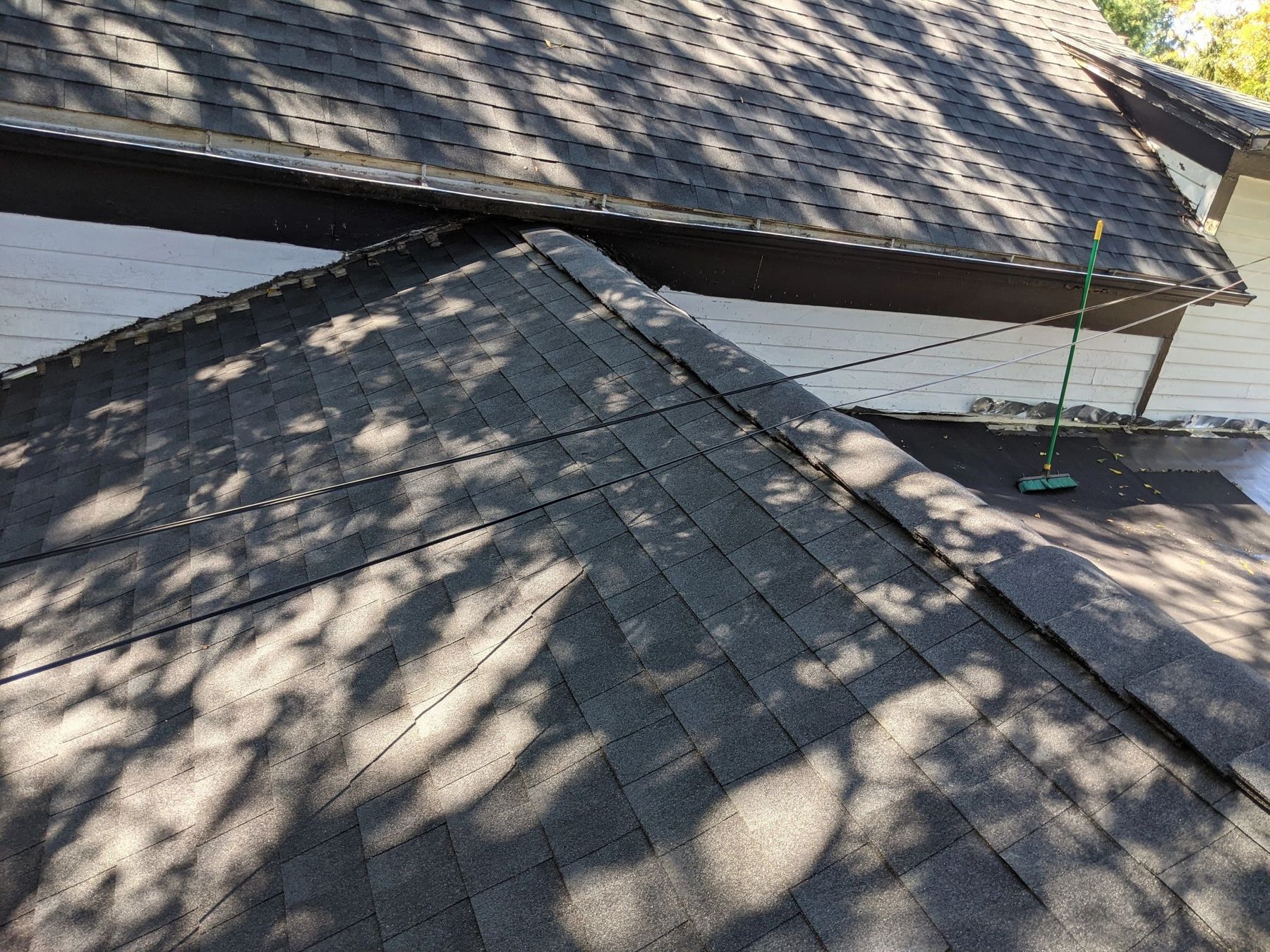 Shingled roof slope and overhang after framing support work